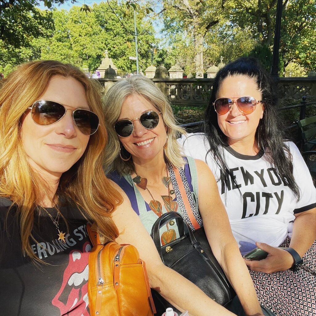 three ladies with sunglasses in central park