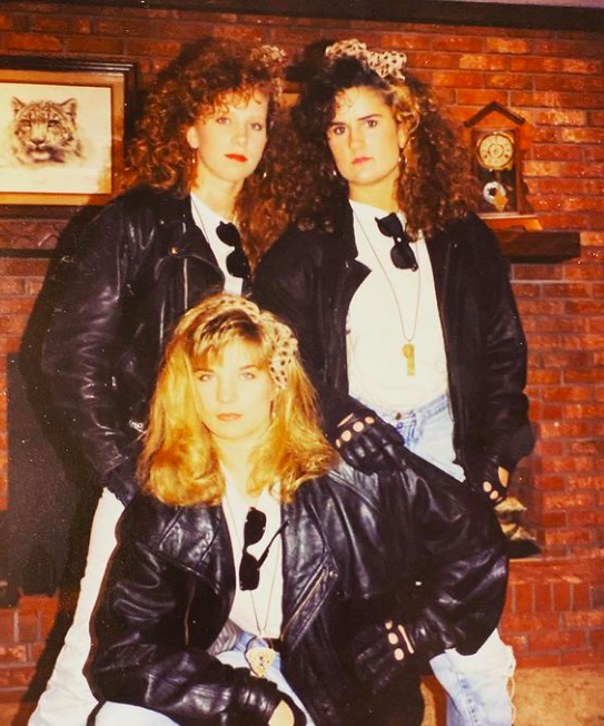 three high school girls in 1990 wearing black leather jackets