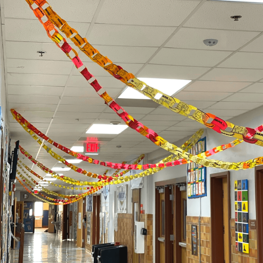 gratitude chain-at-school An elementary school hallway with paper thankful chains draped back and forth