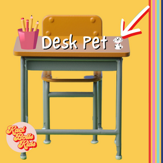 whats-a-desk-pet Tiny dog, or desk pet, sitting on a school desk