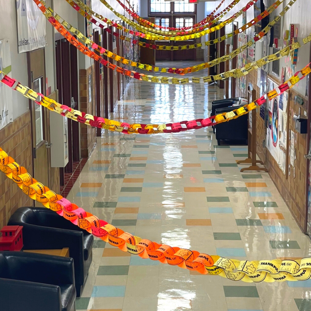 thankful-chain-at-school an elementary school hallway draped in thankful chains
