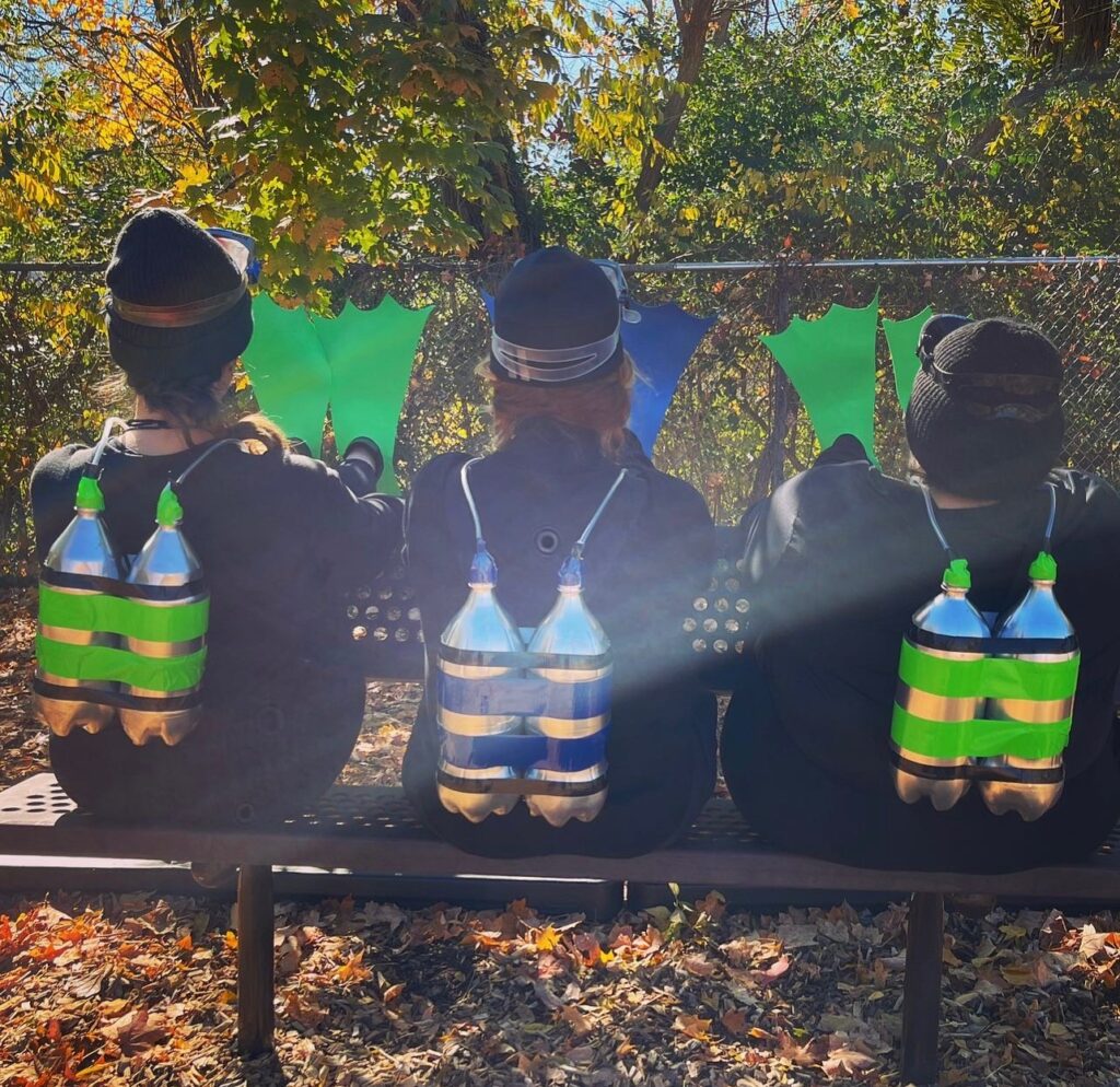 3 kindergarten teachers in scuba gear on bench