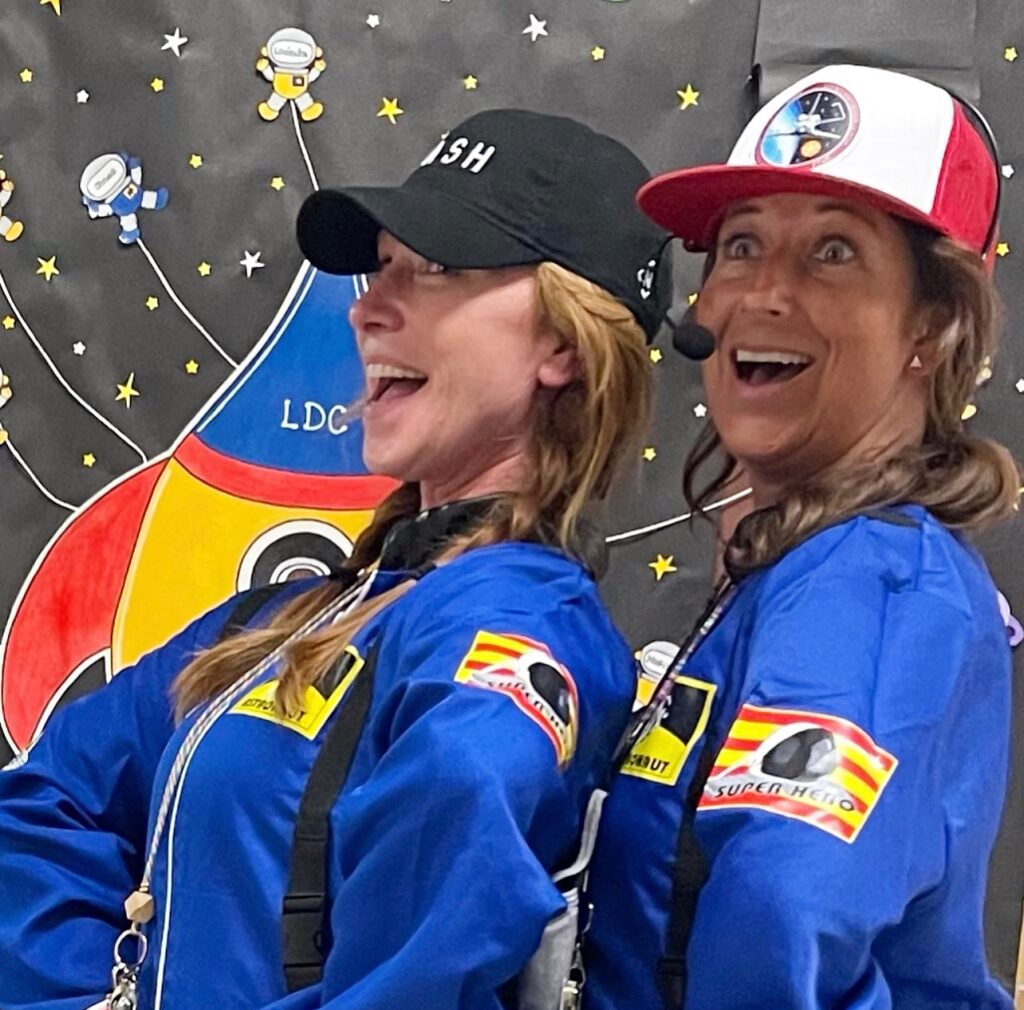 two kindergarten teachers dressed up as space captains